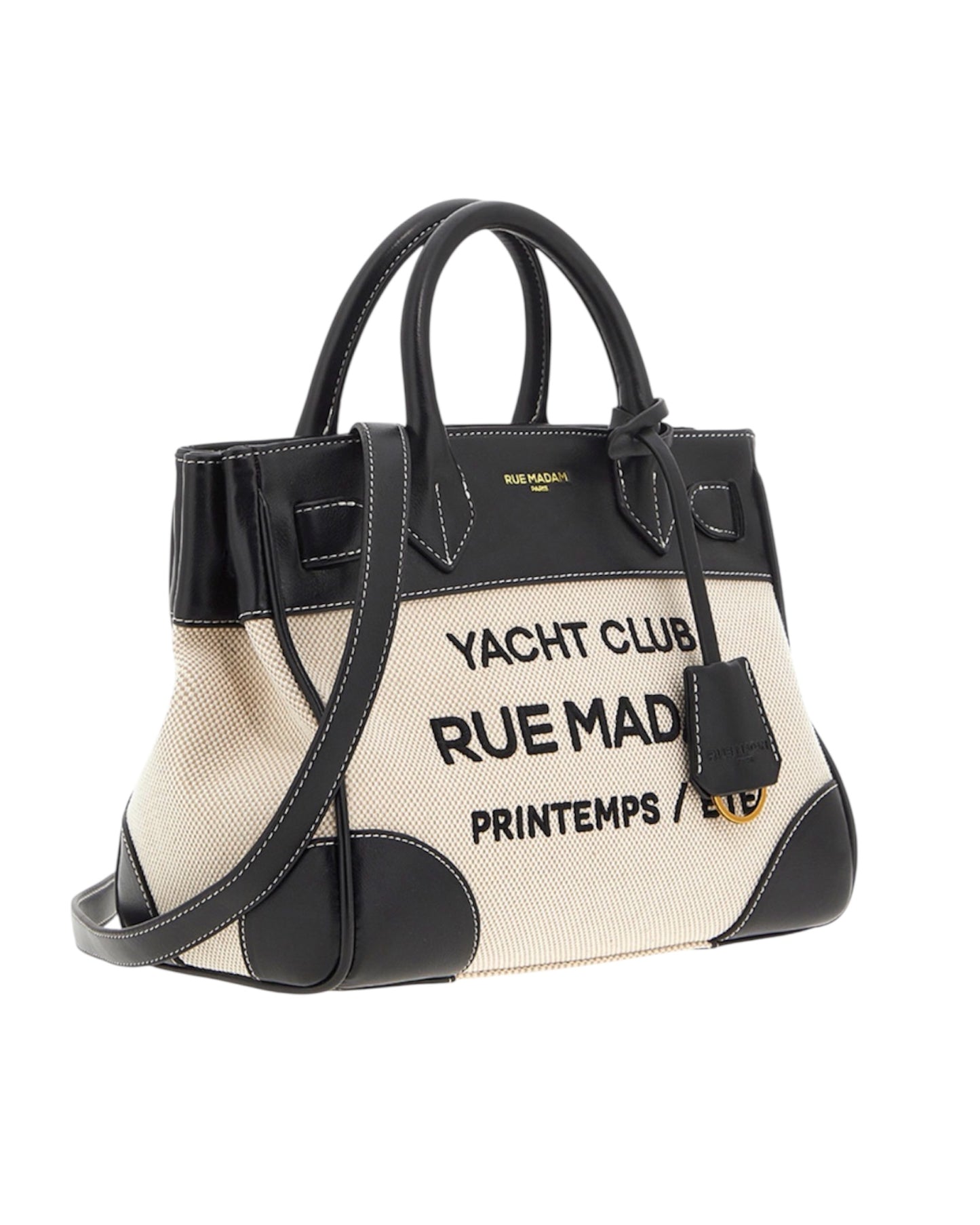 Vista laterale della mini tote bag con dettagli in ecopelle e cuciture a contrasto.