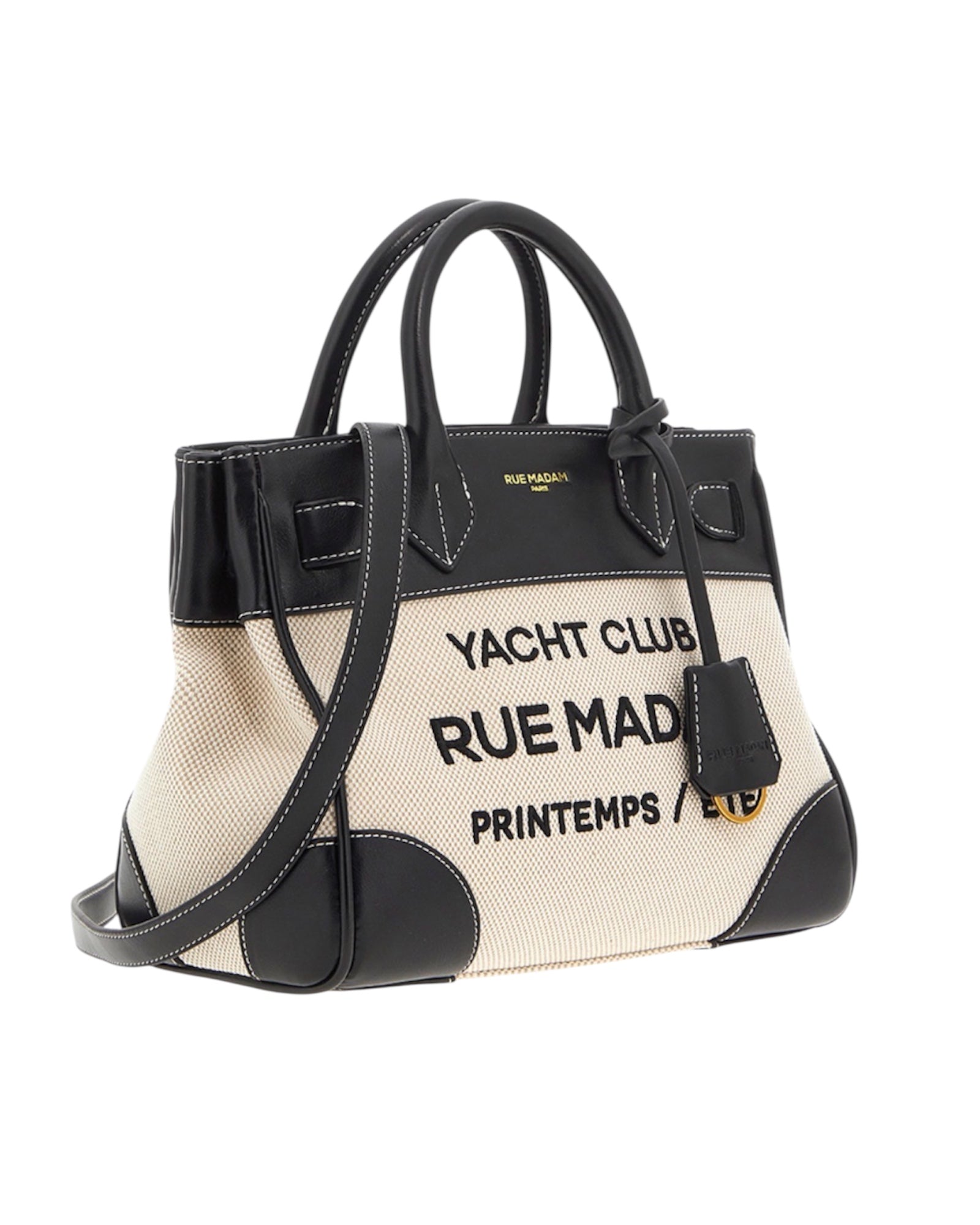 Vista laterale della mini tote bag con dettagli in ecopelle e cuciture a contrasto.